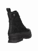 Botín de cuero negro para mujer, diseño atrevido con taco plano, perfecto para destacar con estilo.