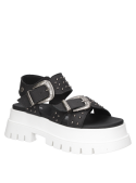 Sandalia negra de cuero con tachas para mujer, diseño contemporáneo y vanguardista.