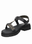 Sandalia negra de cuero con tachas para mujer, diseño contemporáneo y vanguardista.