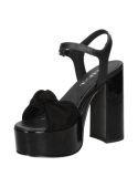 Sandalia negra de cuero para mujer, lazo frontal y plataforma, ideal para eventos donde se requiere elegancia y comodidad.