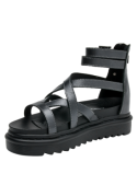 Sandalia de cuero negra para mujer, diseño vanguardista y taco estilizador.