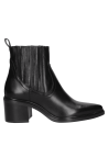 Botín Chelsea de cuero negro para mujer, con tacón estable y puntera elegante, ideal para un look urbano.