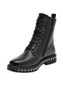 Botín negro vanguardista con tachas, ideal para jeans ajustados o faldas de cuero en eventos informales.