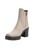 Botín beige estilo Chelsea de cuero para mujer, ideal para un look casual elegante.