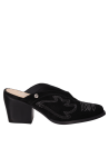 Zapato de mujer en cuero negro, estilo vaquero, con taco bloque que equilibra altura y estabilidad.