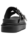 Sandalia de cuero negro para mujer con base estable y altura moderada.