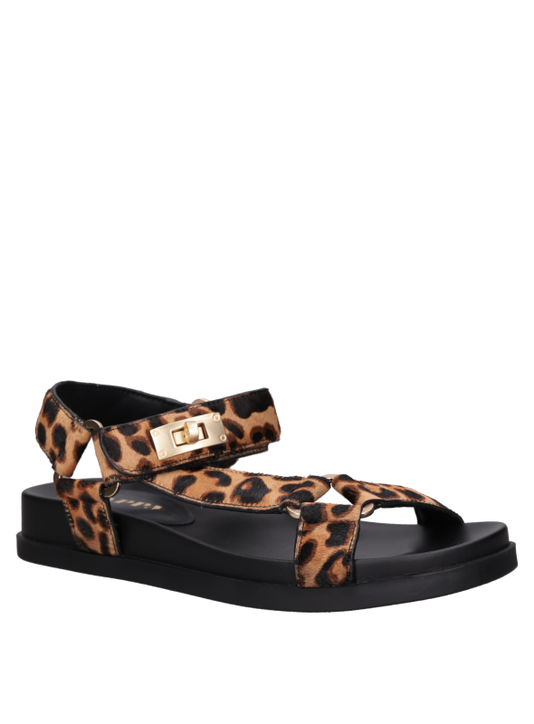 Cuero animal print en sandalia plana de mujer, estilo minimalista para un toque casual y ligero.