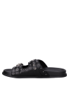 Sandalia plana de cuero negro con empeine descubierto, ideal para un look casual femenino.