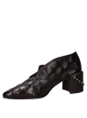 Zapato de salón negro de cuero para mujer con taco bloque y punta puntiaguda, ideal para ocasiones casuales.