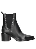 Botín negro de cuero brillante para mujer, estilo urbano, recomendado para salidas informales.