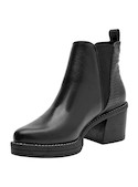 Botín negro de cuero para mujer con punta puntiaguda y acabado brillante, ideal para un estilo urbano.