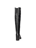 Bota negra de cuero suave para mujer, ideal para looks atrevidos y cómodos en cualquier ocasión.