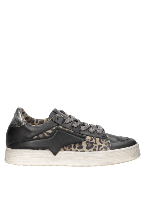 Zapatilla con cordones anchos en gris oscuro, equilibrando lujo e informalidad.